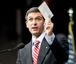 virginia AG Ken Cuccinelli brandishing one of the forms he forgot to fill out.
